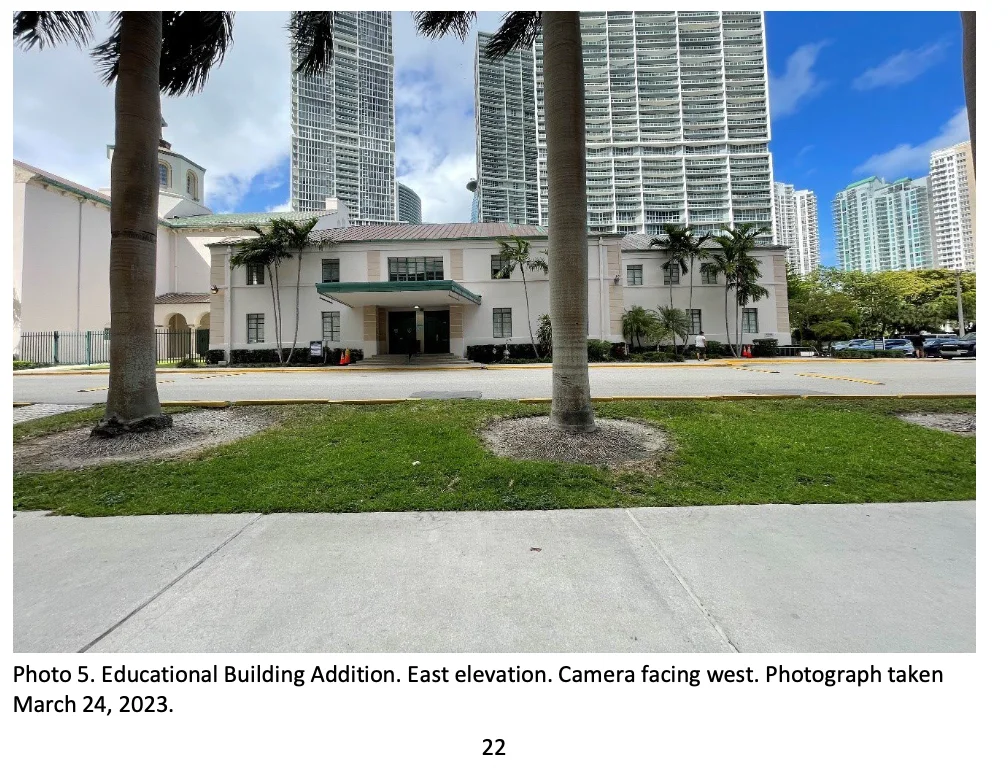 Educational building addition viewed from the east, with palms in the foreground; photograph dated March 24, 2023