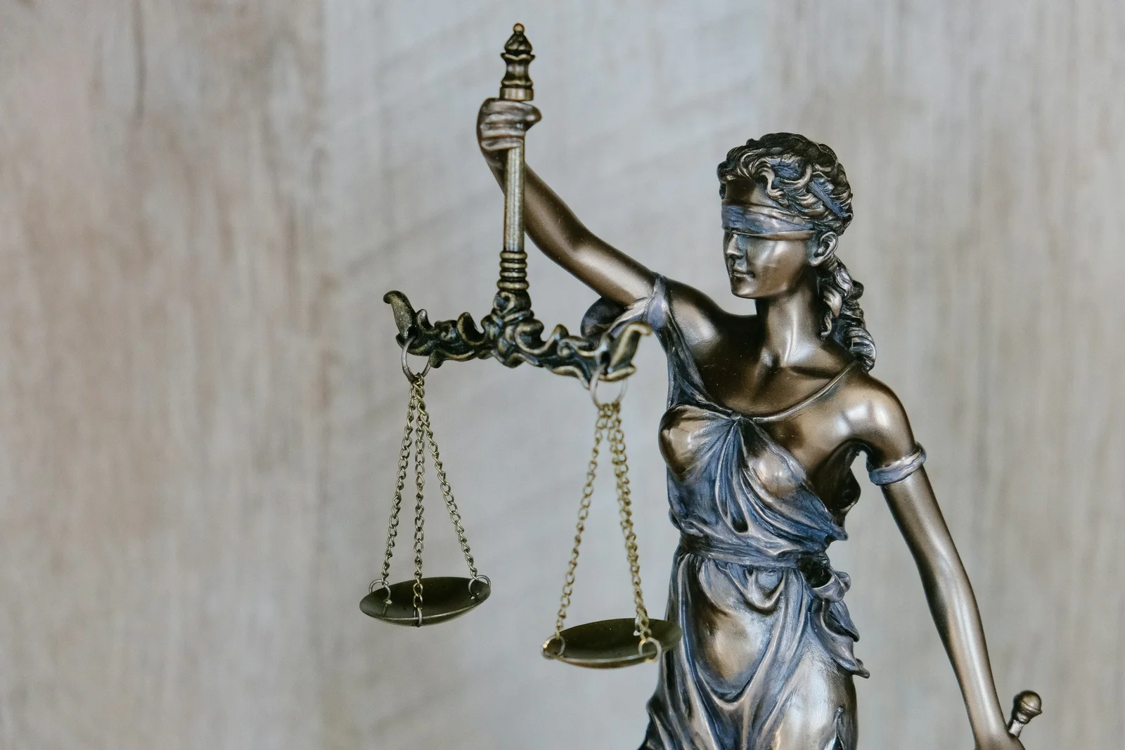 Lady Justice statue holding scales and a sword