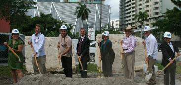 Neighbors and project participants holding shovels at the 2011 Flatiron Park groundbreaking