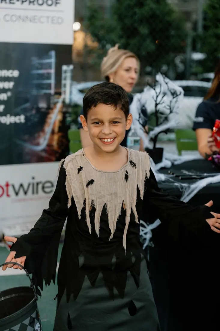 A smiling child in costume at the 2025 Not So Spooky celebration