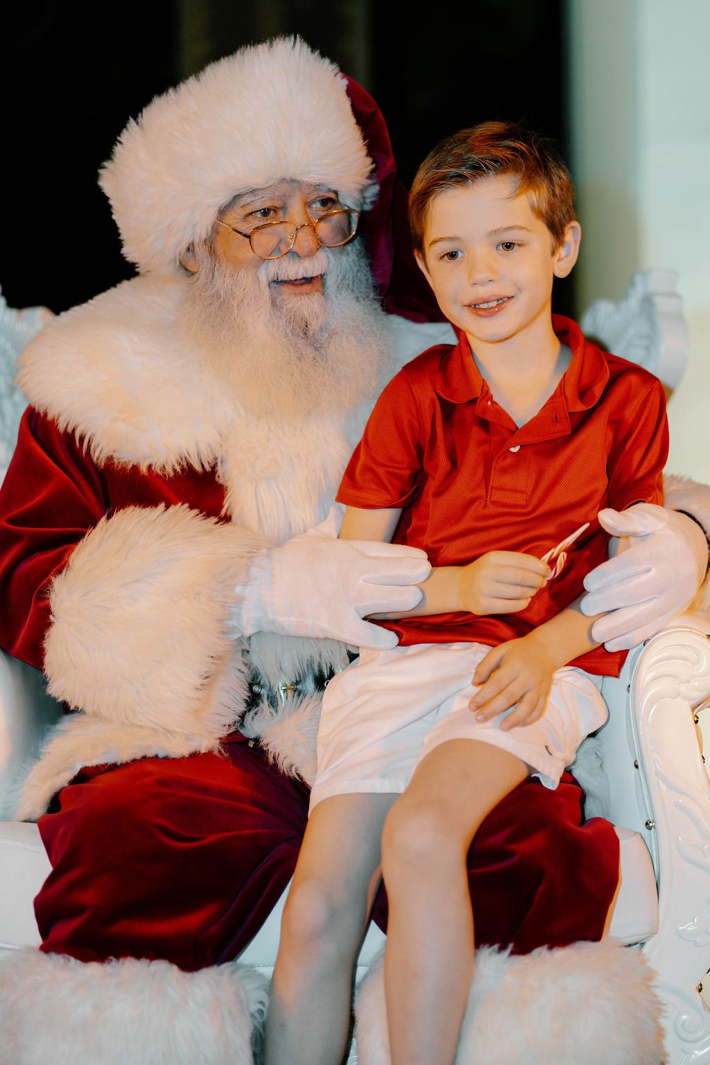 Santa and a young guest at a past BHA holiday celebration